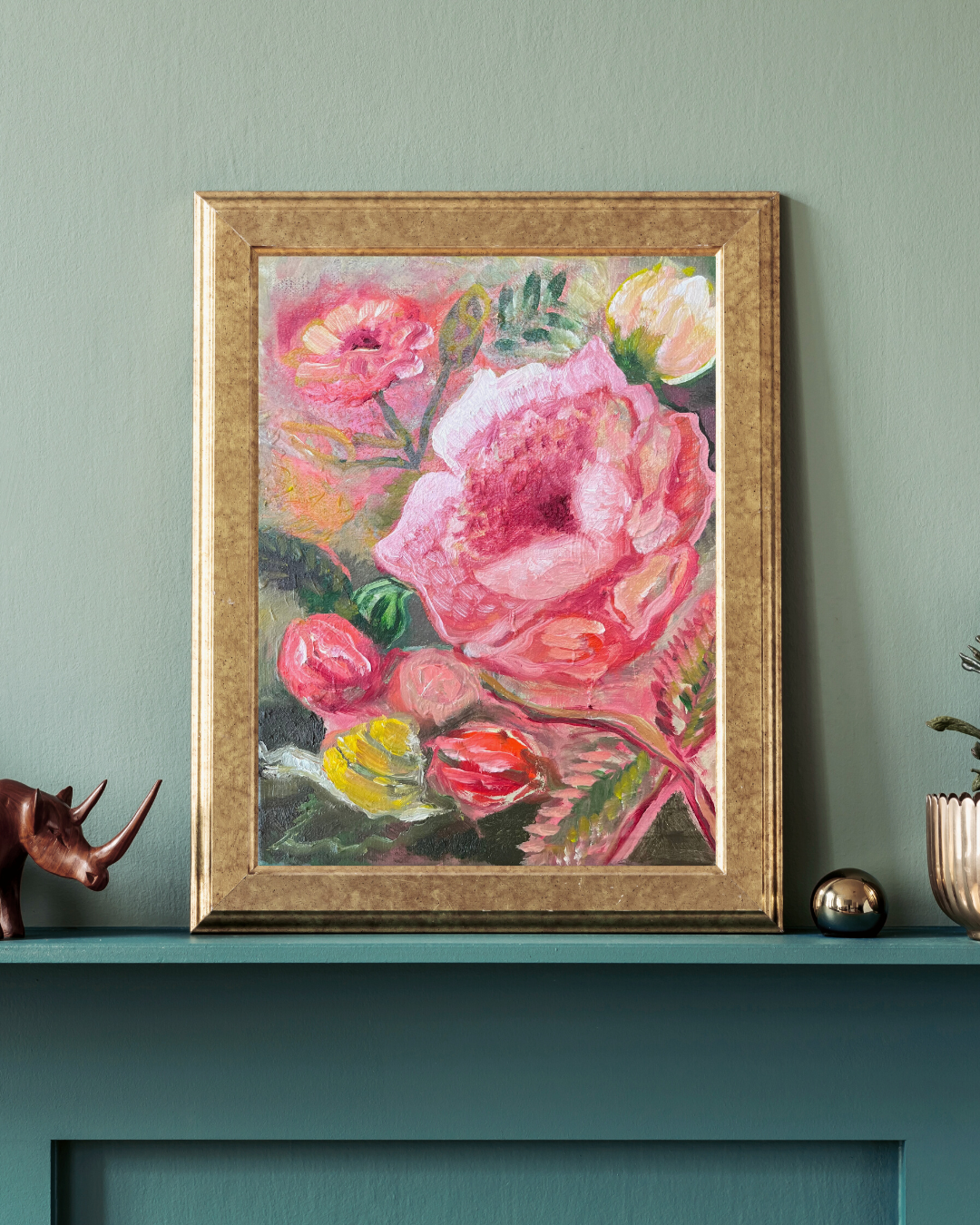 painting of roses on a green mantel